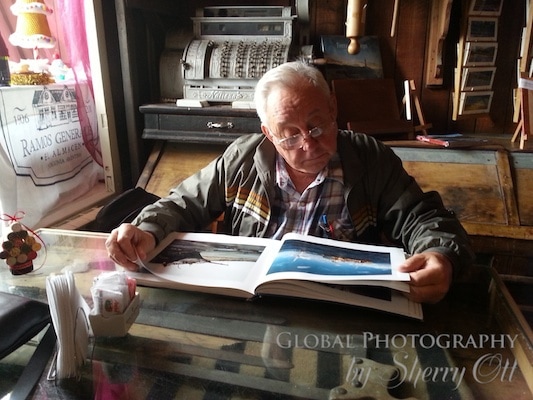Dad looking at an Antarctica photography book
