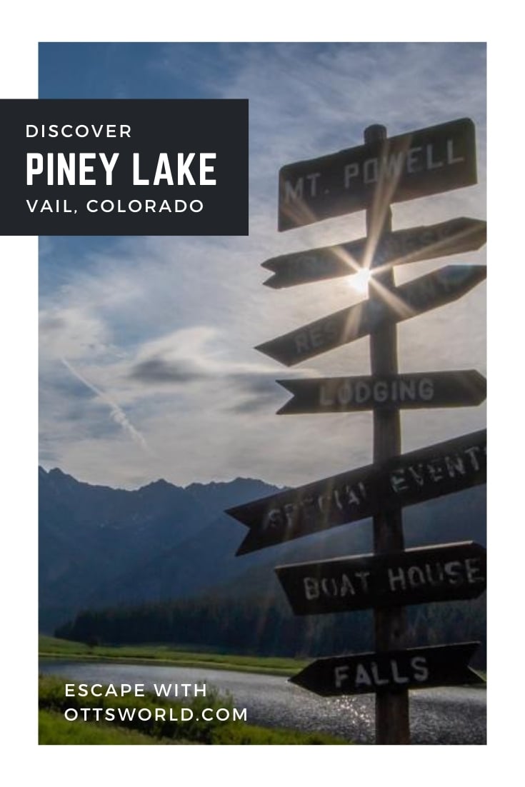 signpost on mountain lake