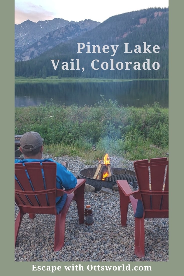 man adirondack chairs campfire mountain lake