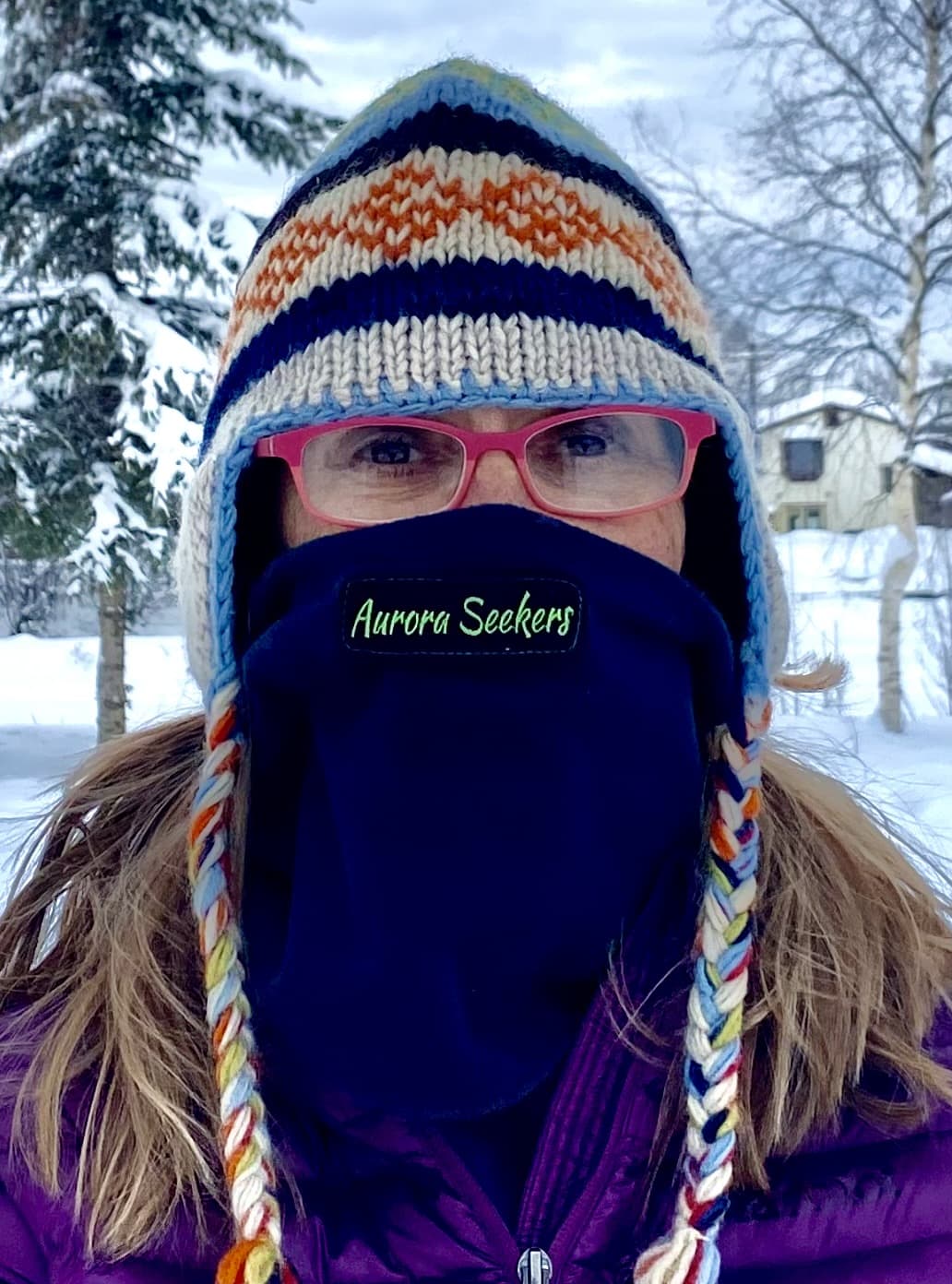 Photo of author wearing hat and neck wrap in the cold